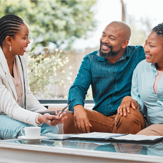 A financial professional discussing Protective ProClassic Legacy UL with two customers.