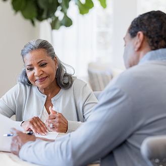 Woman discusses Protective Smart Saver NY fixed annuity with her financial professional.