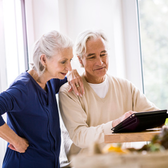 Woman using her laptop to research information on low-risk fixed annuities