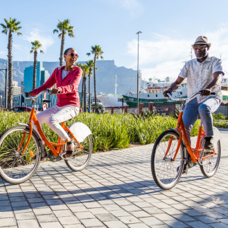 Couple riding bikes representing the idea of exploring an immediate annuity.