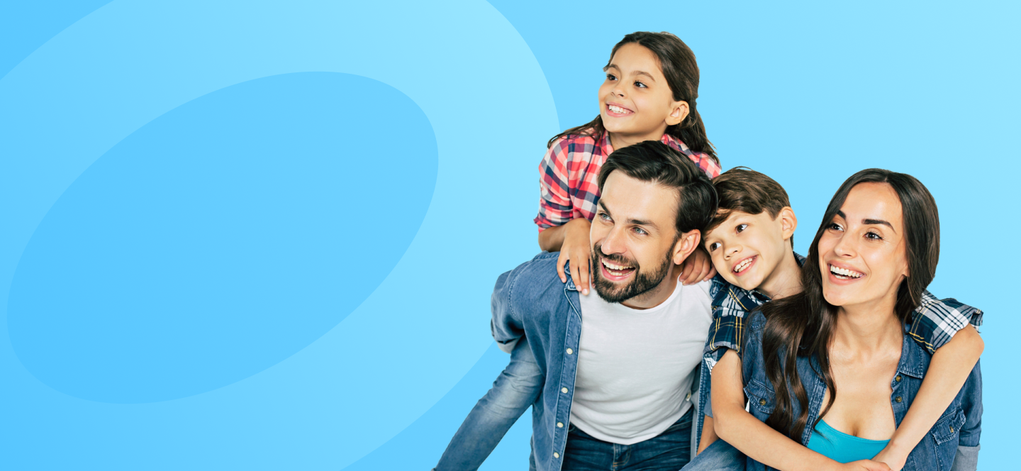 A smiling mother, father and their two children.