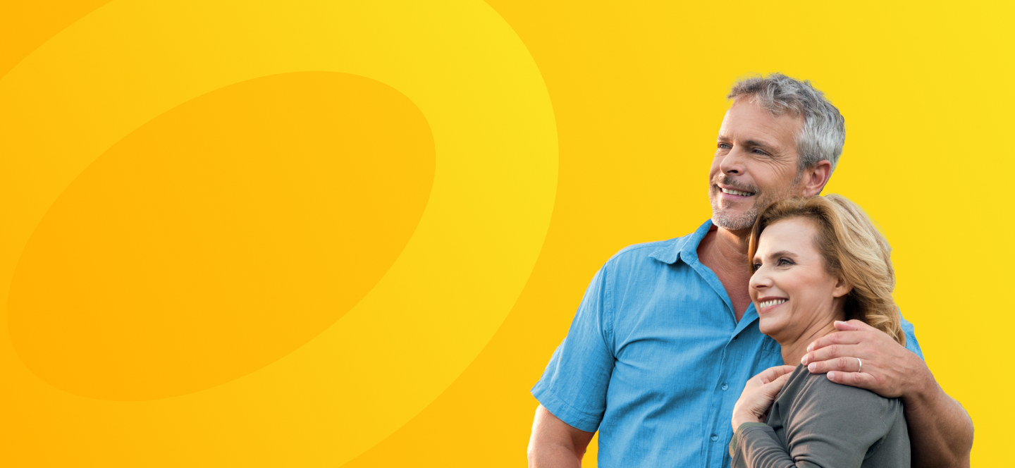 A retired couple smiling. 