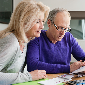 Man and woman reviewing details about their retirement plan.