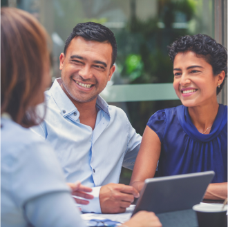 A couple meets with a financial professional to discuss lifetime income options available with Protective Aspirations variable annuity.