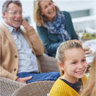 A couple enjoying time with their grandchildren, knowing they are protected with Protective Advantage Choice universal life insurance.