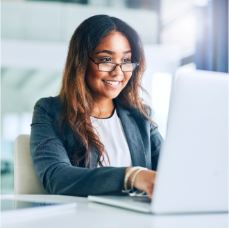 A financial professional using a laptop to check on the status of her customer's claim with Protective.