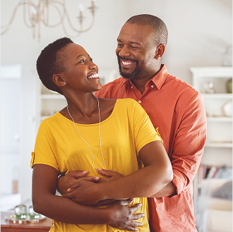 A couple on a porch, smiling about their Social Security benefits.