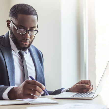 A financial professional using a laptop to access Protective’s enhanced performance center.