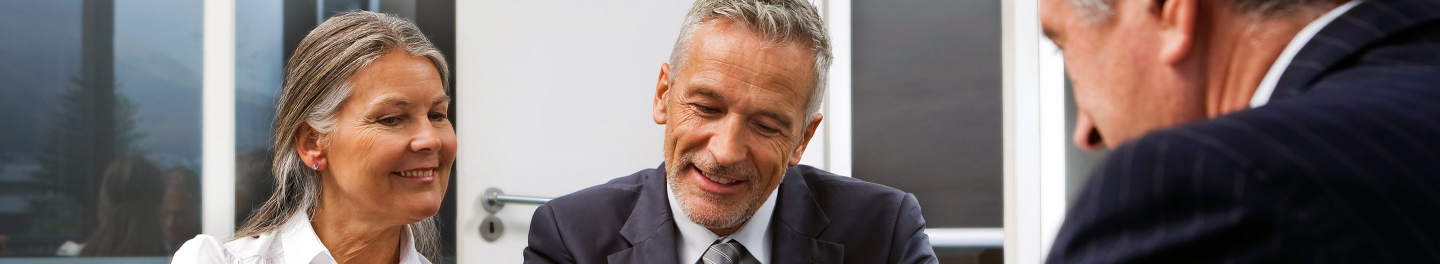 Financial professional discussing retirement income risks with clients.