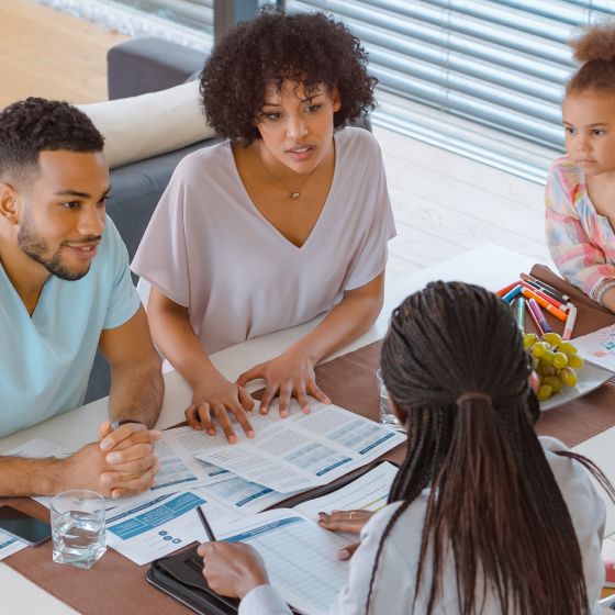 A financial professional discussing the optional benefits available on Protective ProClassic Legacy UL with a young family
