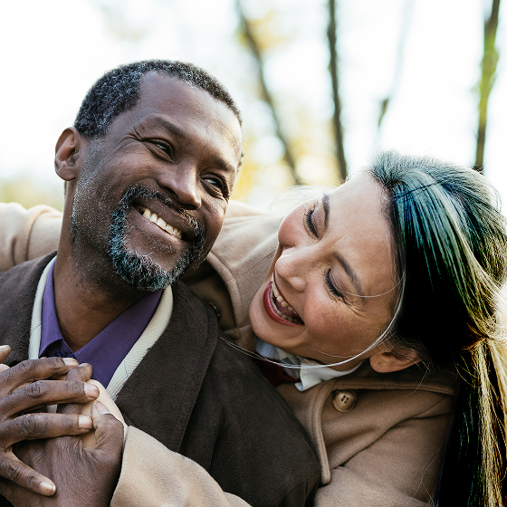A couple relaxing on the couch knowing they’re protected with Protective Income Creator fixed annuity.